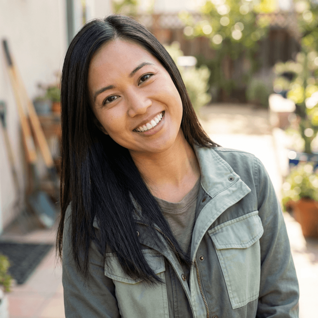 Casey Nguyen in a bright kitchen with a tablet showing a weekly planner